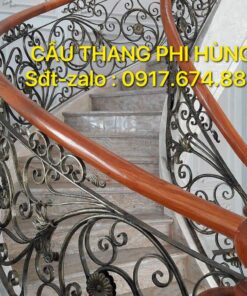 Cầu thang sắt nghệ thuật tay vịn gỗ, đơn vị thi công cầu thang lan can số 1 Hà Nội