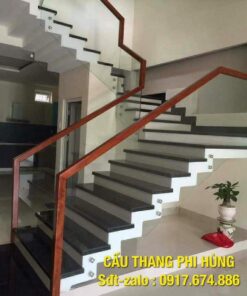 Cầu thang kính tay vịn gỗ, cầu thang kính cường lực. Báo giá cầu thang lan can kính cường lực tay vịn gỗ tại Hà Nội